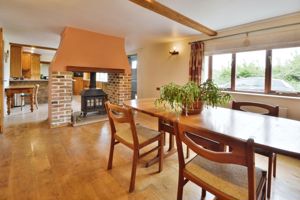 Dining room with double sided log burner- click for photo gallery